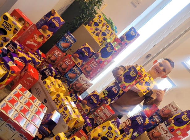Archie with the Easter eggs he has collected