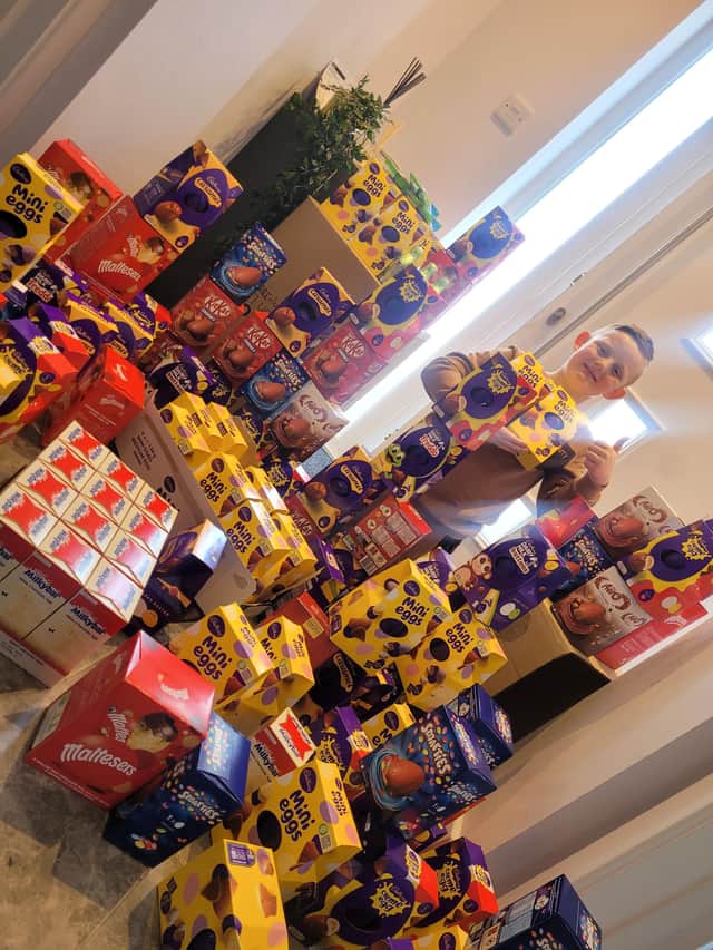 Archie with the Easter eggs he has collected