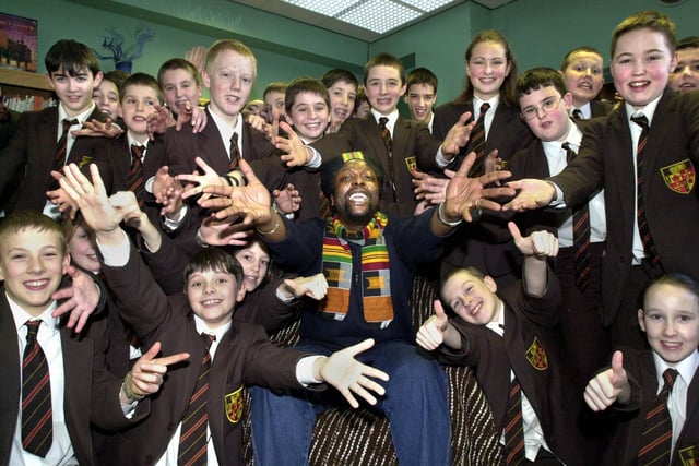 Pupils of St. Peter's RC High School, Orrell, join in a chant with Rastafarian poet Levi Tafari during a visit on Tuesday 5th of March 2002.