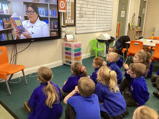 St. John's Abram Pupils watching QUEST Trust team members reading stories