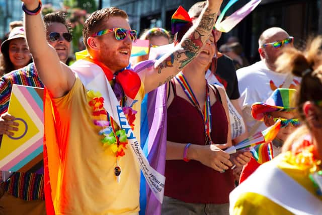 WWL colleagues walking in the parade - Joe Usher LGBTQIA Network Chair