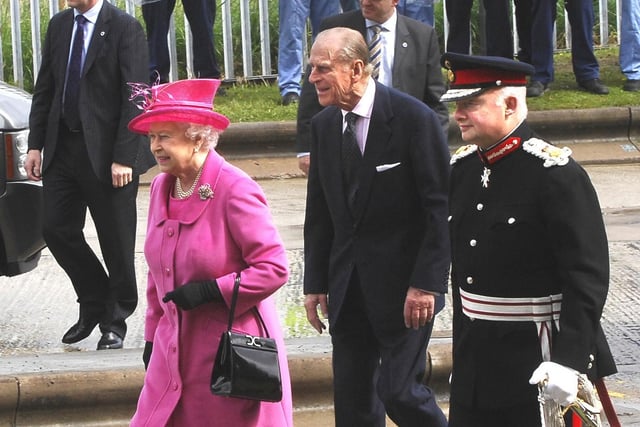The Queen and Prince Philip are cheered by workers as they tour Heinz.