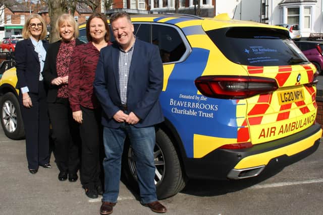 Heather Arrowsmith (CEO at North West Air Ambulance Charity), Susie Nicholas (Beaverbrooks Charity Manager), Anna Blackburn (Beaverbrooks Managing Director) and Paul Holly (Beaverbrooks Head of Community Responsibility) in front of the new Critical Care Vehicle.