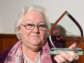 Pauline Carr is presented with the Heart of the Community Award