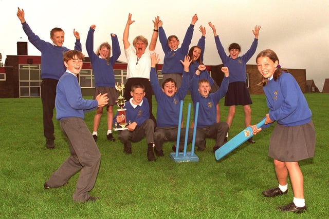 Howzat !  Kwik cricket kings St, Marie's RC Primary School, Standish, Year 6 pupils who have won the North of Wigan heat and now qualify for the Wigan tournament and further down the line a possible place in the finals at Old Trafford. Helping them celebrate is PE teacher, Linda Unsworth.