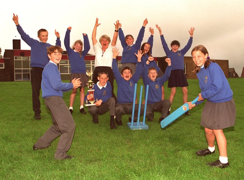 Howzat !  Kwik cricket kings St, Marie's RC Primary School, Standish, Year 6 pupils who have won the North of Wigan heat and now qualify for the Wigan tournament and further down the line a possible place in the finals at Old Trafford. Helping them celebrate is PE teacher, Linda Unsworth.