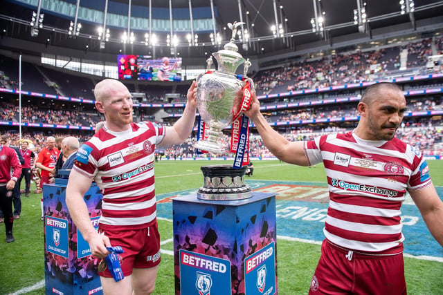 Liam Farrell and Thomas Leuluai collect the trophy.