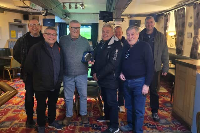 Colin Holland receives the Community Champion award from councillors Chris Ready and Ron Conway and members of Aspull Forum