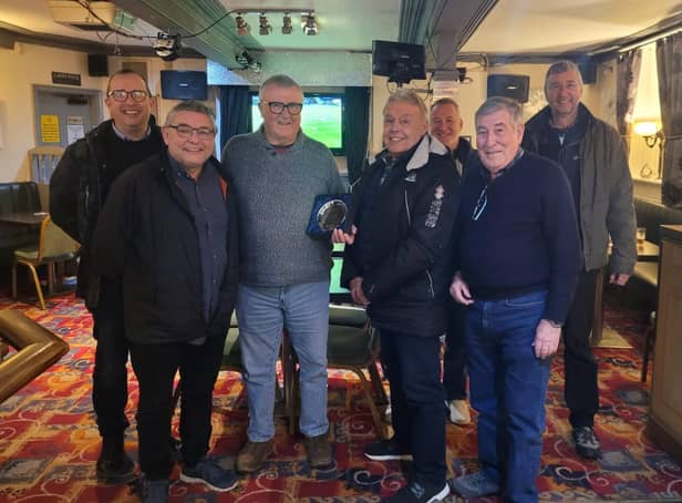 Colin Holland receives the Community Champion award from councillors Chris Ready and Ron Conway and members of Aspull Forum