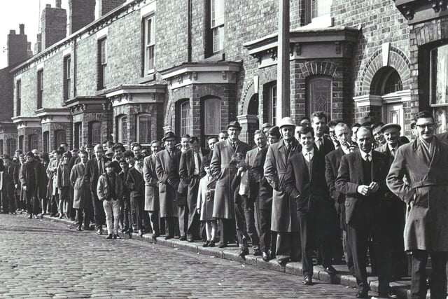 Wigan rugby fans queue up along Hilton Street leading to Central Park to buy tickets for a cup semi-final against Swinton in 1965.