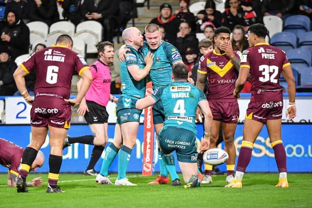 Wigan Warriors overcame Huddersfield Giants
