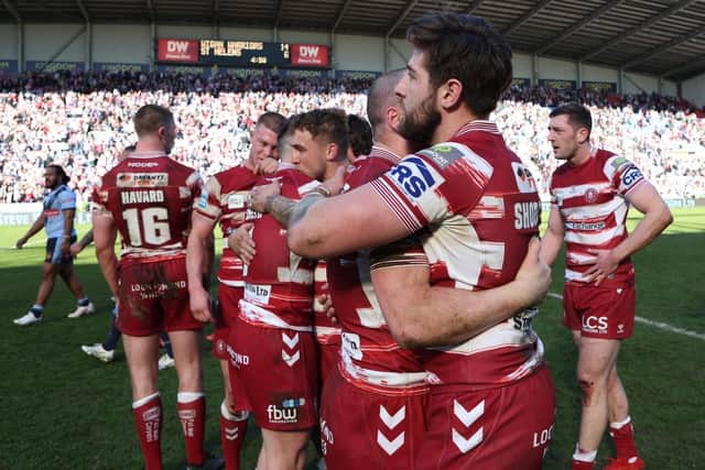The Wigan players celebrate their win