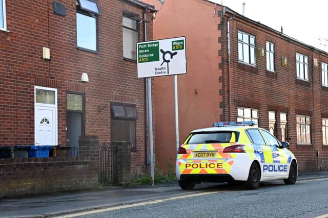 Police outside the scene of the tragedy on Ince Green Lane, Ince, earlier this week