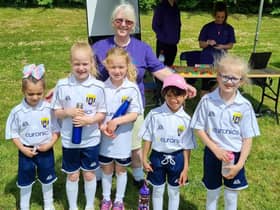 Vicky Johnson and some of her young footballing protegees