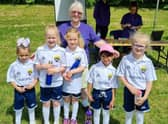 Vicky Johnson and some of her young footballing protegees