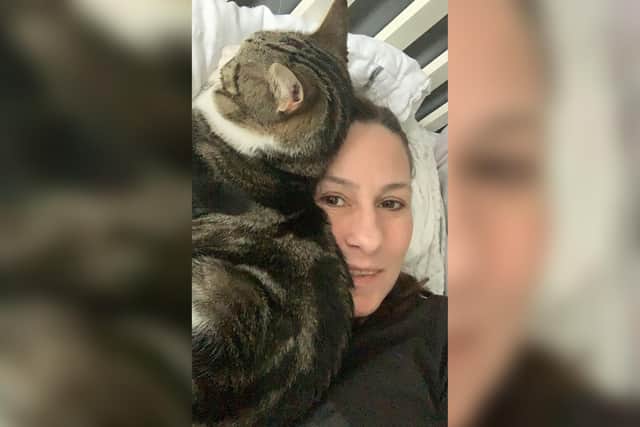 Sarah Moor pictured with her cat Alfie, who's been missing since October