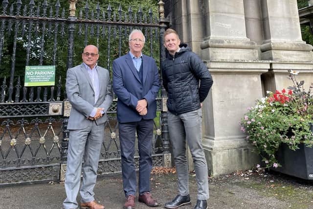 Left to right: Keith Bergman (general manager, Haigh Woodland Park), Coun David Molyneux MBE (Leader, Wigan Council) and Stuart Holden (Be Well Wigan service manager) outside the Plantation Gates