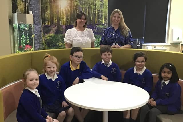 L-R Jamie Fox (Learning Mentor) and Carrie Kiselis (Deputy Headteacher) with pupils from Canon Sharples Church of England Primary School and Nursery.