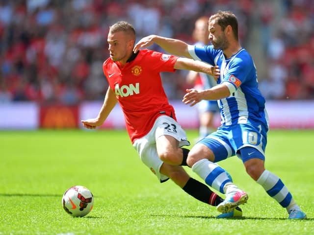 Tom Cleverley battles Shaun Maloney during the 2013 Charity Shield between Manchester United and Latics