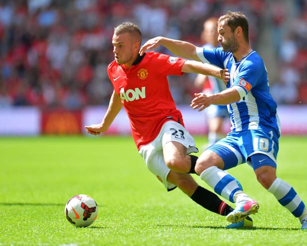 Tom Cleverley battles Shaun Maloney during the 2013 Charity Shield between Manchester United and Latics