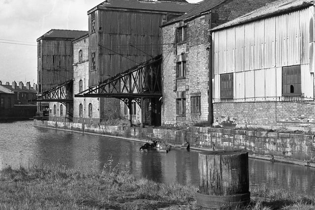 A dilapidated canal side view of Wigan Pier in 1968