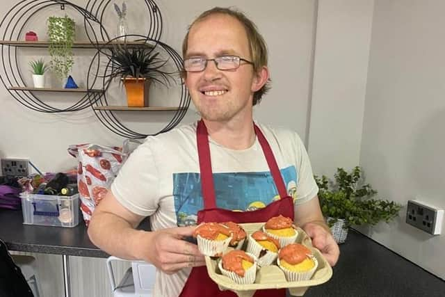 Christian, volunteer cook at Embrace's community cafe