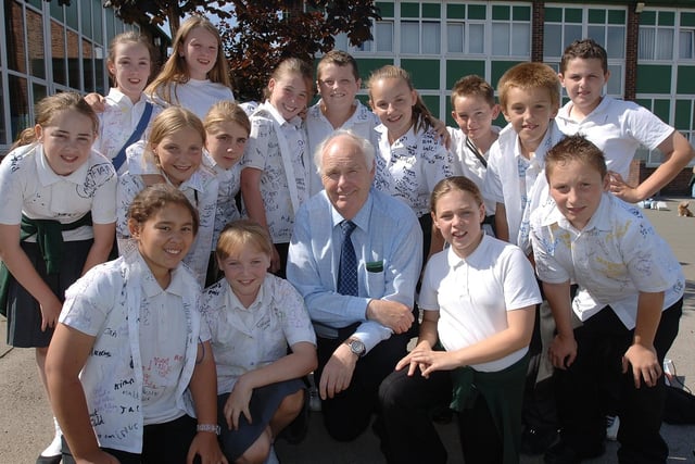 Teacher Michael Dean retires from St Cuthbert's Catholic Primary School, surrounded by pupils, after 39 years in the job, the last 34 of them being spent at Norley Hall.
