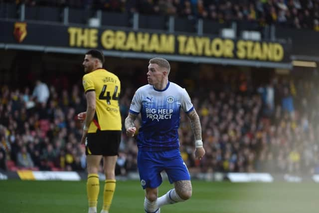 James McClean heads Latics level off the underside of the bar