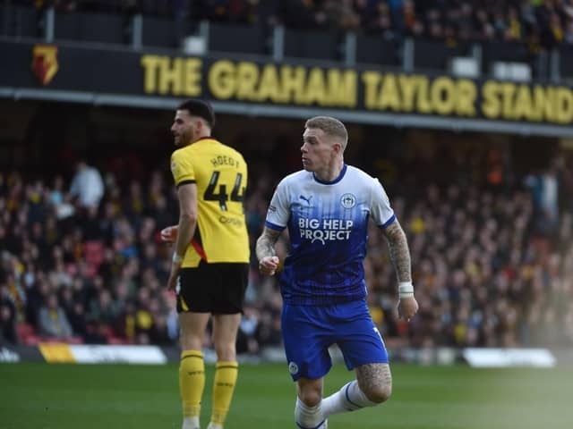 James McClean heads Latics level off the underside of the bar