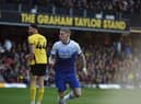 James McClean heads Latics level off the underside of the bar