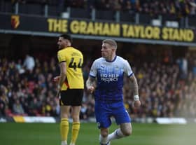 James McClean heads Latics level off the underside of the bar
