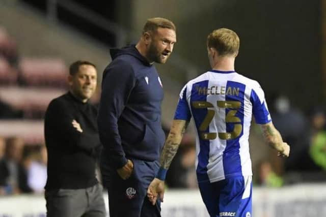 Ian Evatt has a chat with James McClean during Latics' Carabao Cup victory earlier in the campaign
