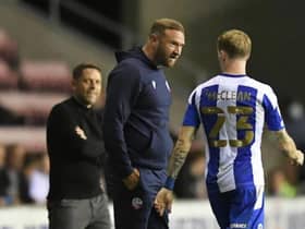 Ian Evatt has a chat with James McClean during Latics' Carabao Cup victory earlier in the campaign