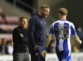 Ian Evatt has a chat with James McClean during Latics' Carabao Cup victory earlier in the campaign