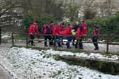 The injured man is stretchered to safety by members of Bolton Mountain Rescue Team