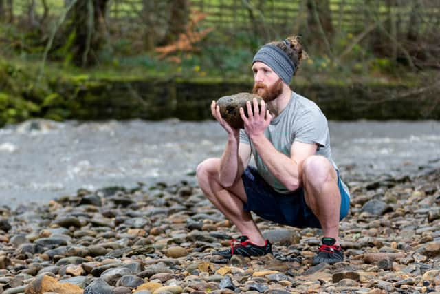 Bowland Fitness founder Matt Donnelly doing a squatting exercise outside. Photo: Kelvin Stuttard