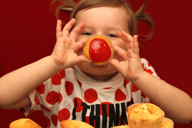 Darcie Rae Campbell aged 4 from Atherton made cup cakes for Comic Relief Red Nose Day in her Great -Grandma's kitchen and sold them at Meadow Bank Primary School in 2015