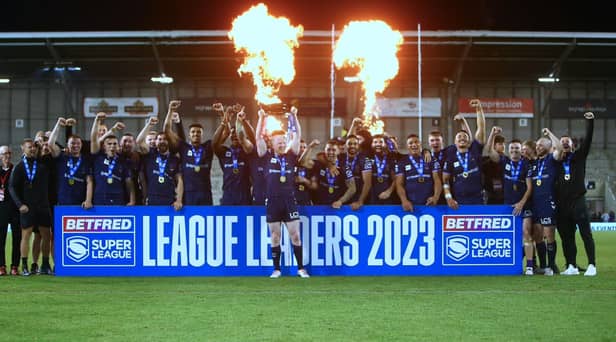 Wigan Warriors celebrate winning the League Leaders' Shield