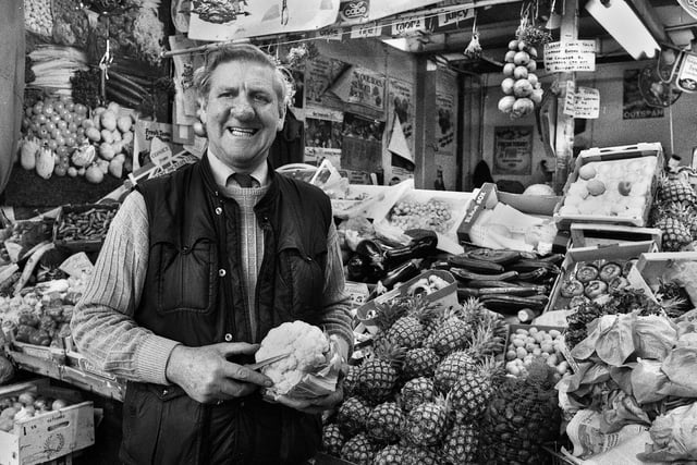 Ken Hall on his fruit and vegetable stall in the old Wigan market hall in December 1987.