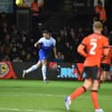 Rarmani Edmonds-Green heads the ball away against Luton