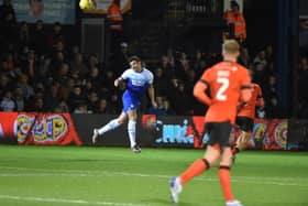 Rarmani Edmonds-Green heads the ball away against Luton