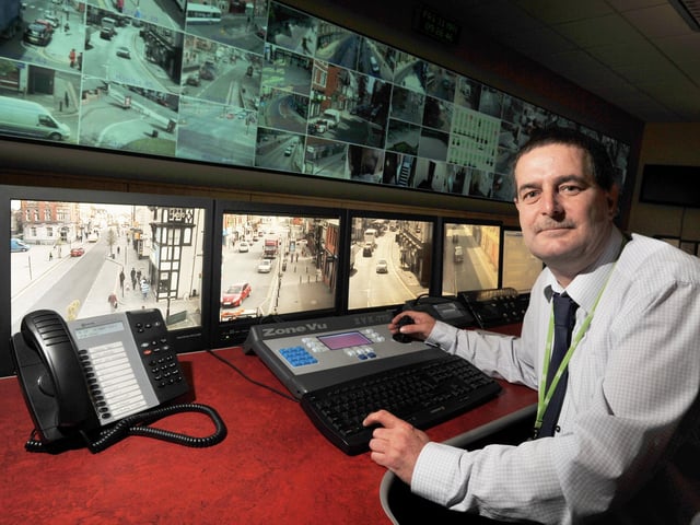 Safer communities officer Grahame Morris in the CCTV room: Wigan Council Safer Environment team.