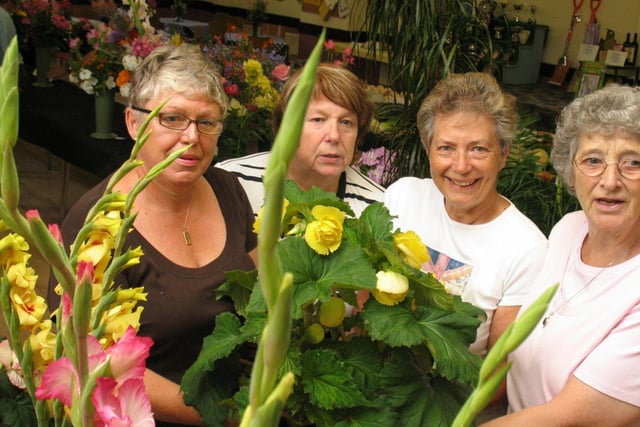 Celia Worthington, Carol Moakes, Elieen Longmoore and Hilda Green with beautiful flowers in 2006