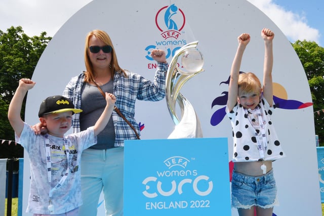 Suzy Ratcliffe with Jaxon, five, and Allana, eight, right, pictured with the Women's Euro 2022 trophy, 
Family fun at children and adults take part in the interactive workshops at the Women's Euro 2022 Roadshow, held at Mesnes Park, Wigan.