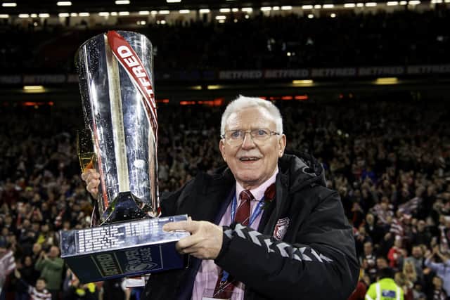 Outgoing Wigan chairman Ian Lenagan with the Betfred Super League tropy after his side's victory over Catalans