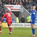 Matt Smith wheels away in delight after putting Latics ahead