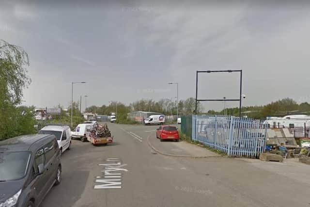 Miry Lane, in Wigan, where multiple vehicles were found ablaze.