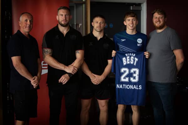 Mike Cooper and Ryan Hampshire presented shirts to the Wigan BEST squad