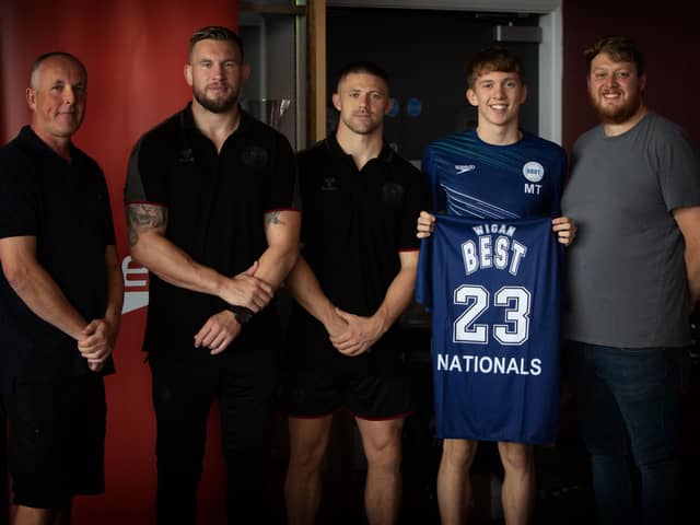 Mike Cooper and Ryan Hampshire presented shirts to the Wigan BEST squad