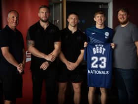 Mike Cooper and Ryan Hampshire presented shirts to the Wigan BEST squad